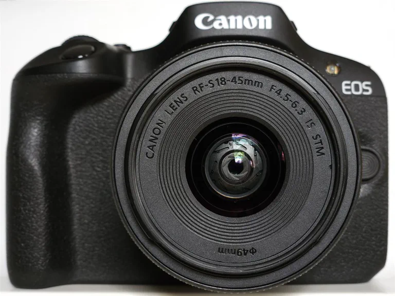 Canon EOS R100 mirrorless camera with RF-S 18-45mm kit lens.