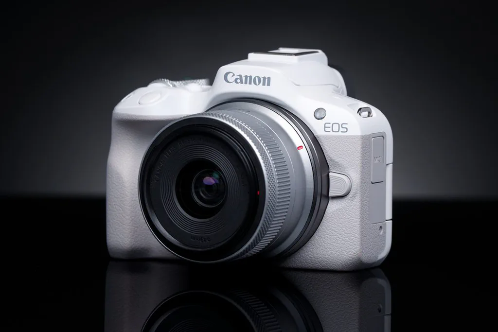 Canon EOS R50 mirrorless camera with compact kit lens.