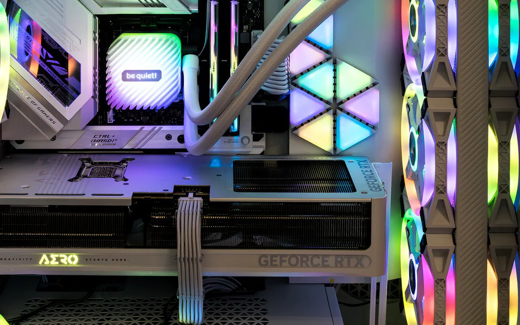 Representative open PC interior showing a graphics card, memory, cooling and case airflow for a custom PC build guide.