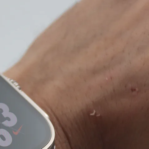 A premium smartwatch on a wrist, used as the cover for the smartwatch versus fitness tracker buying guide.